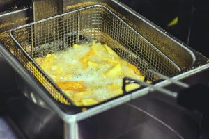 Frying potatoes by cooking oils